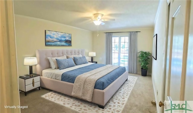 bedroom featuring carpet floors, crown molding, and ceiling fan