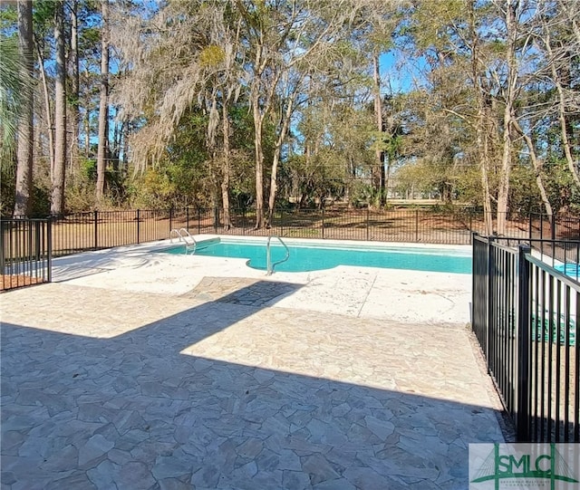 view of pool featuring a fenced in pool, a patio, and fence