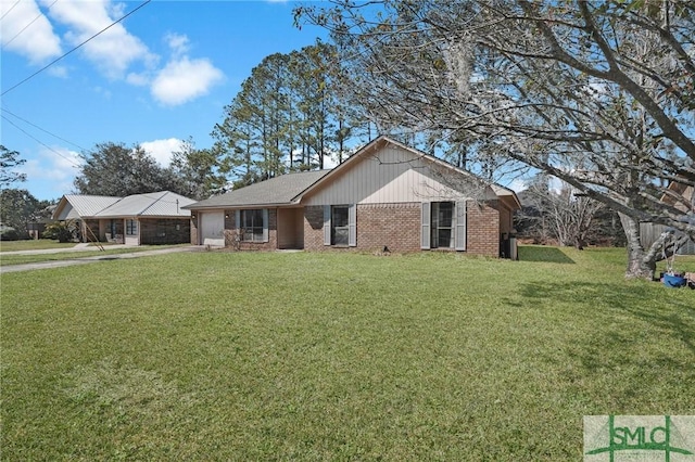 ranch-style home with an attached garage, driveway, a front yard, and brick siding