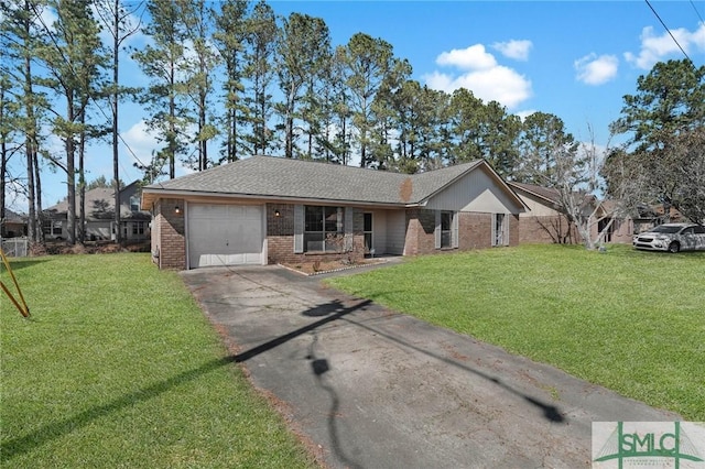 single story home with a front lawn, an attached garage, brick siding, and aphalt driveway