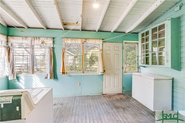 unfurnished sunroom featuring wood ceiling and beam ceiling