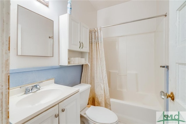 bathroom with shower / tub combo, vanity, and toilet