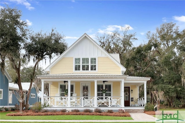 view of front of property with a porch, metal roof, ceiling fan, and board and batten siding