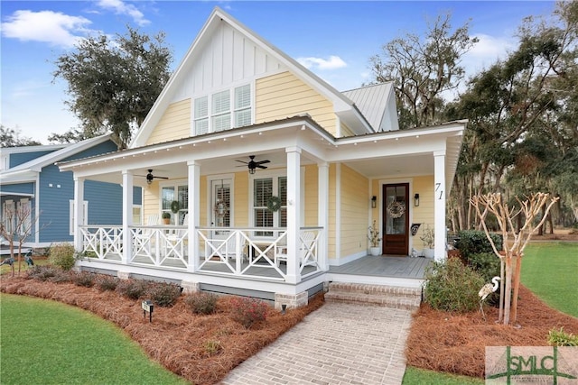 view of front facade with a porch, metal roof, ceiling fan, and board and batten siding