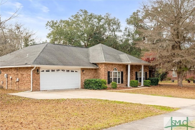 view of front facade featuring a garage, brick siding, and roof with shingles