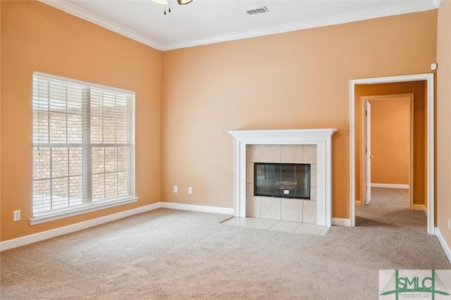 unfurnished living room featuring carpet, crown molding, a fireplace, visible vents, and baseboards