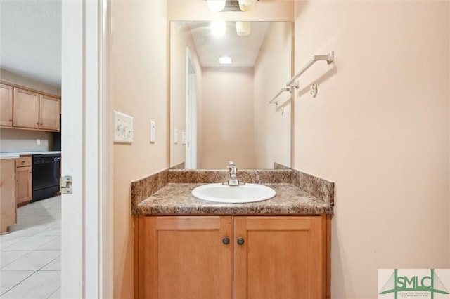 bathroom with tile patterned flooring and vanity