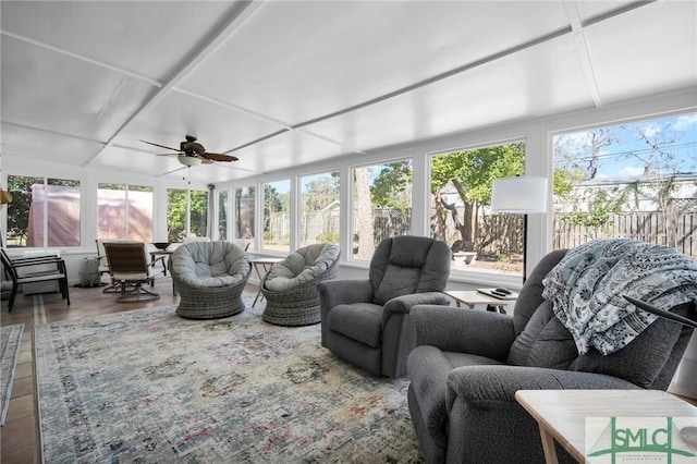 sunroom / solarium featuring a wealth of natural light and ceiling fan