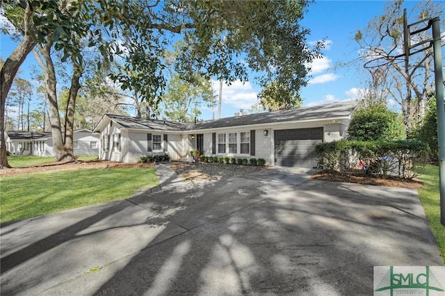 ranch-style house featuring a garage, driveway, brick siding, and a front lawn