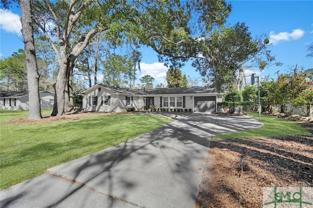 ranch-style house with an attached garage, driveway, and a front lawn