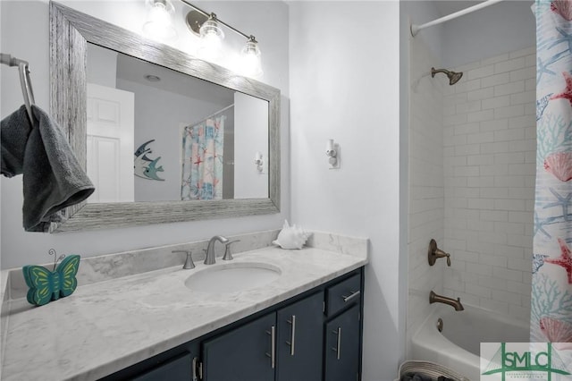 bathroom featuring shower / tub combo and vanity