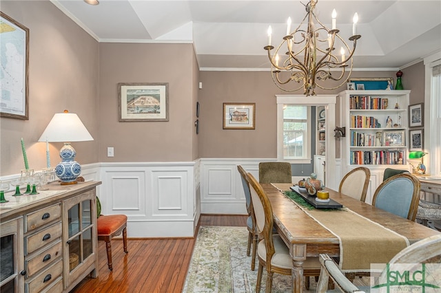 dining room featuring a wainscoted wall and crown molding