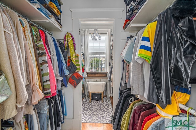 202 E 49th St, Savannah, GA 31405 - spacious closet featuring wood finished floors and a chandelier