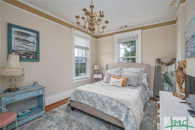 202 E 49th St, Savannah, GA 31405 - bedroom featuring a chandelier, wood finished floors, and ornamental molding