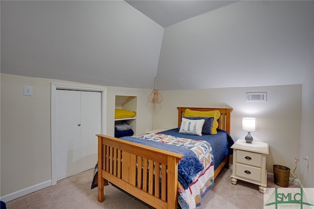 bedroom with light carpet, vaulted ceiling, visible vents, and baseboards