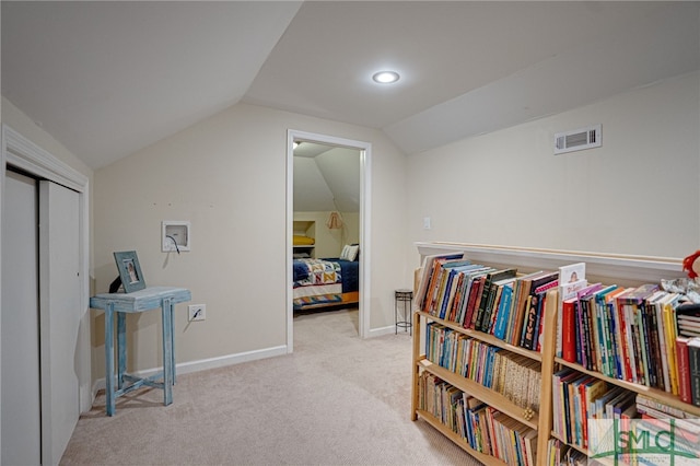 living area with vaulted ceiling, carpet, visible vents, and baseboards