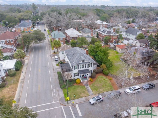 birds eye view of property with a residential view