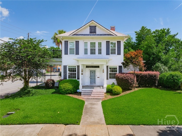 202 E 49th St, Savannah, GA 31405 - view of front of house with a chimney and a front lawn