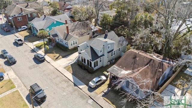 birds eye view of property with a residential view