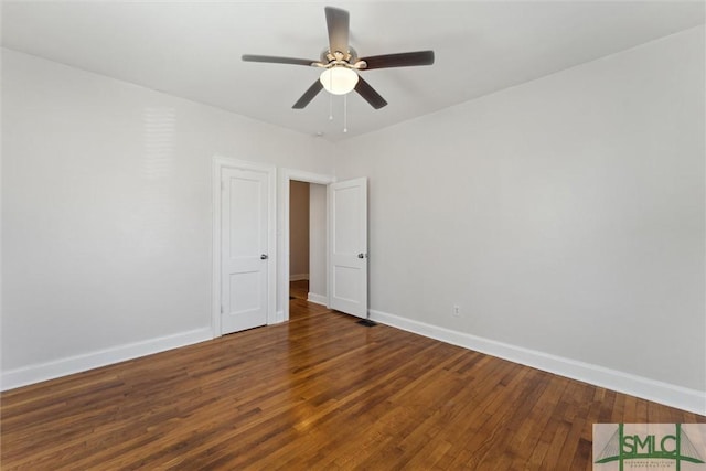 unfurnished room featuring a ceiling fan, wood-type flooring, and baseboards