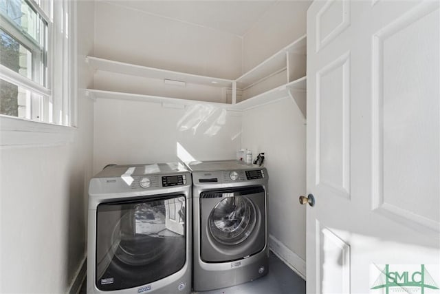 washroom with laundry area and independent washer and dryer