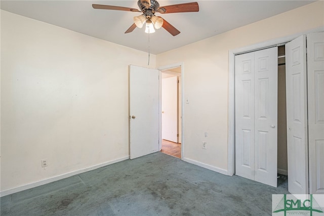 unfurnished bedroom featuring a closet, carpet flooring, a ceiling fan, and baseboards