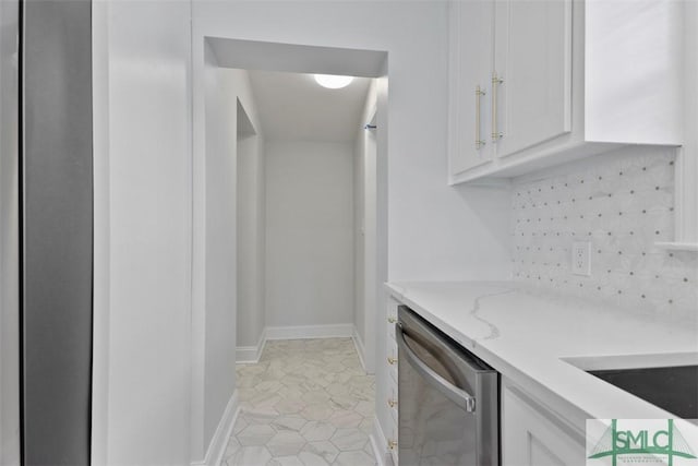 kitchen featuring light tile patterned floors, light stone countertops, white cabinets, decorative backsplash, and dishwasher