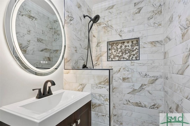 bathroom featuring crown molding, vanity, and a walk in shower