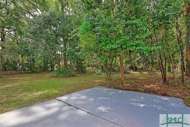 view of patio featuring a wooded view