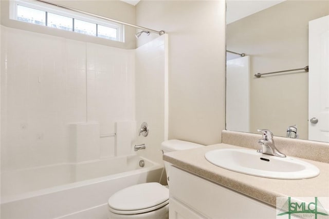 bathroom with toilet, bathtub / shower combination, and vanity