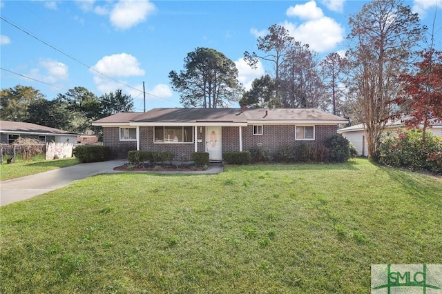 ranch-style home with concrete driveway, brick siding, and a front lawn