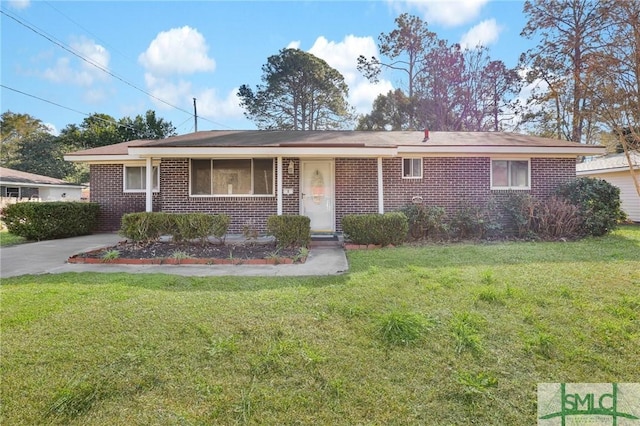 single story home featuring brick siding and a front lawn