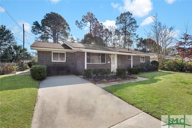 single story home featuring driveway, brick siding, and a front yard