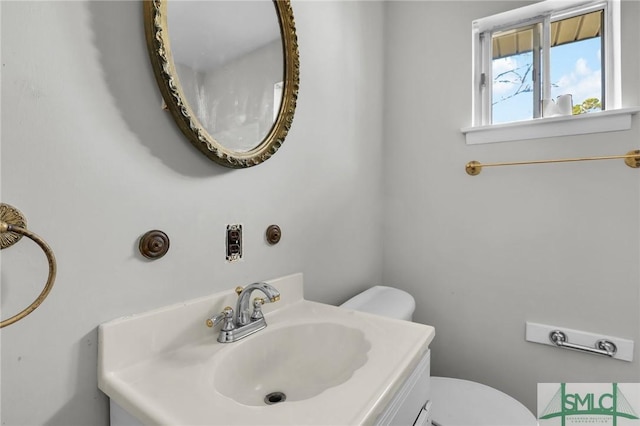 half bath with toilet and vanity