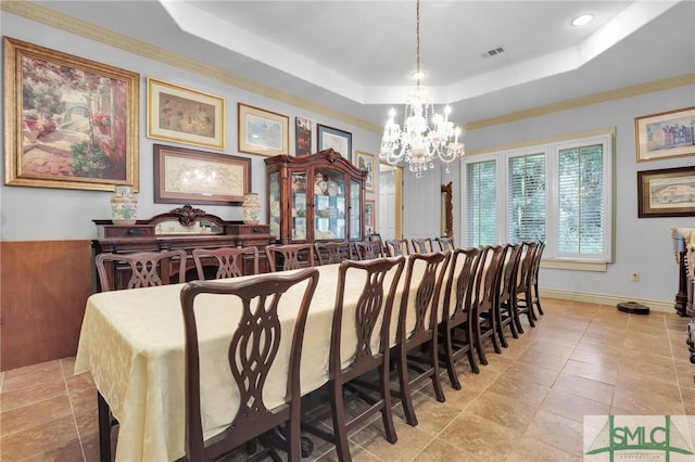 dining area with baseboards, a raised ceiling, visible vents, and an inviting chandelier