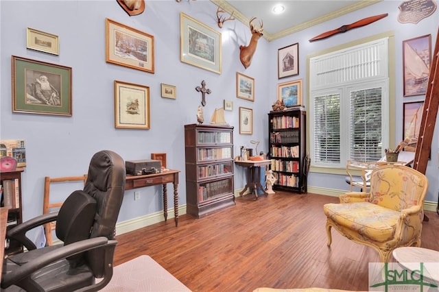 office featuring ornamental molding, wood finished floors, and baseboards