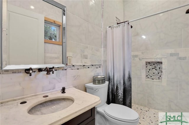2132 Grove Point Rd, Savannah, GA 31419 - bathroom featuring a tile shower, tile walls, toilet, and decorative backsplash