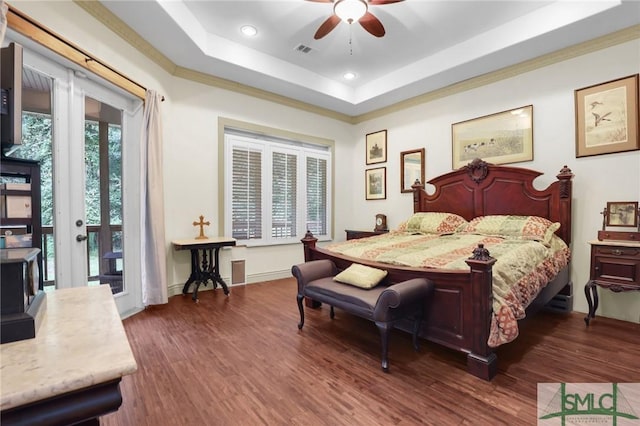 bedroom with recessed lighting, wood finished floors, visible vents, access to exterior, and a raised ceiling