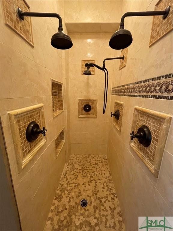 2132 Grove Point Rd, Savannah, GA 31419 - bathroom featuring tile walls and tiled shower