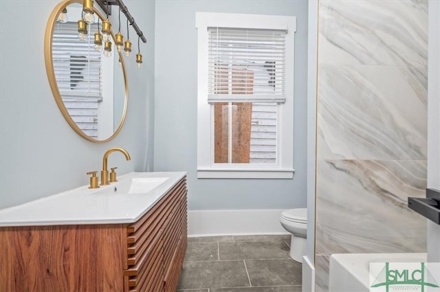 full bathroom featuring a bath, tile patterned flooring, vanity, and toilet