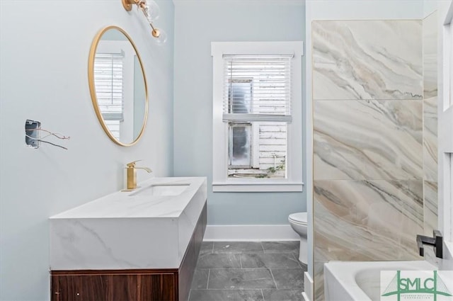 bathroom with a tub to relax in, vanity, toilet, and baseboards