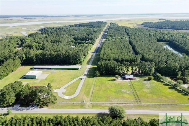 drone / aerial view with a rural view and a wooded view