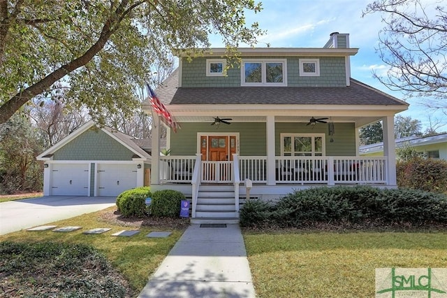 bungalow featuring roof with shingles, a chimney, a porch, a ceiling fan, and driveway