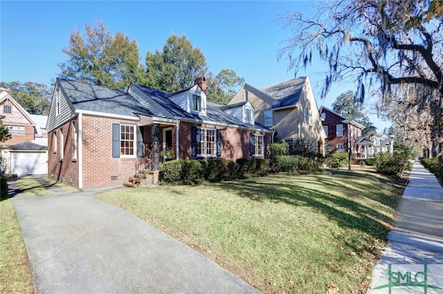 cape cod home with brick siding, an outdoor structure, crawl space, a chimney, and a front yard