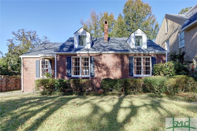 view of front of house featuring a front yard and brick siding