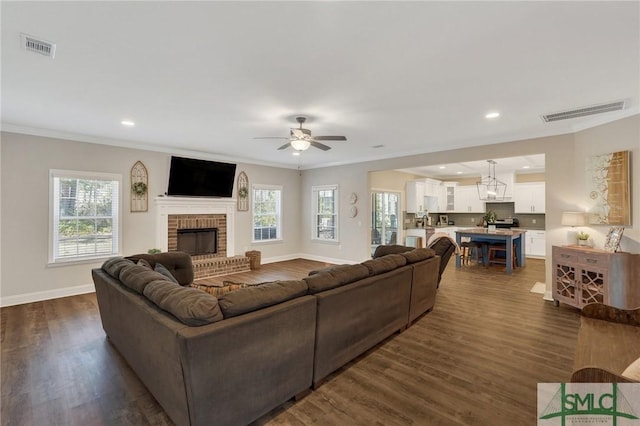 living room with dark wood-type flooring and visible vents