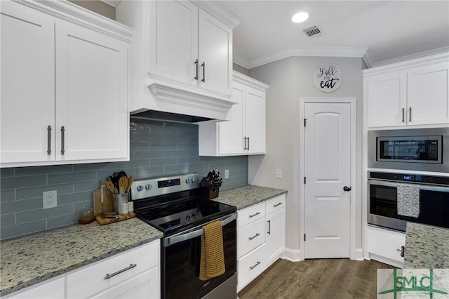 kitchen featuring stainless steel appliances, dark wood-type flooring, white cabinets, custom range hood, and crown molding