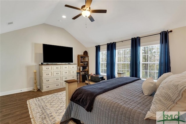 bedroom featuring visible vents, baseboards, a ceiling fan, wood finished floors, and vaulted ceiling