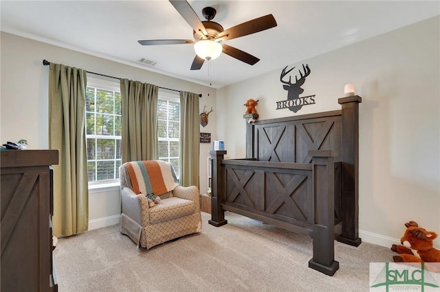 living area featuring carpet floors, visible vents, and baseboards