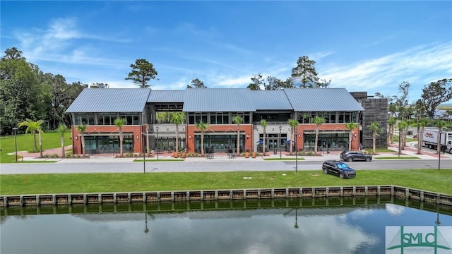 view of building exterior with a water view